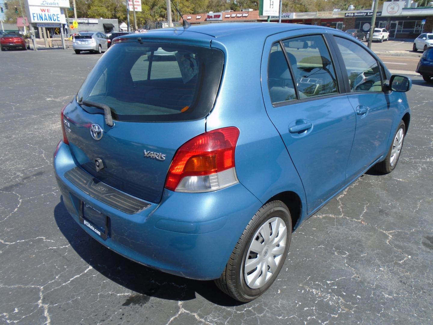 2010 BLUE /Grey Toyota Yaris Liftback 5-Door AT (JTDKT4K39A5) with an 1.5L L4 DOHC 16V engine, 4-Speed Automatic transmission, located at 6112 N Florida Avenue, Tampa, FL, 33604, (888) 521-5131, 27.954929, -82.459534 - Photo#3